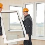 two_windows_installation_workers_installing_double-glass_pane