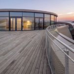 This_image_shows _the_Rooftop_Terrace_of_the_ESO_Supernova_Planetarium_&_Visitor_Centre_at_sunset.__The_roof,_which_weighs_almost_30_tonnes,_consists_of_glass_panels_set___into_a_metal_framework_made_of_262_triangular_sections,_artistically__arranged_to_r
